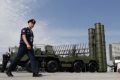epa07194791 (FILE) - A Russian military official walks in front of The S-400 'Triumph' anti-aircraft missile system during the Army 2017 International Military Technical Forum in Patriot Park outside Moscow, Russia, 22 August 2017 (reissued 28 November 2018). According to reports, Russia is planning to deploy S-400 missile systems on the Crimean Peninsula in the wake of the latest crisis with Ukraine. Three Ukrainian war ships were seized and their crew arrested by Russian navy for an alleged violation of the Russian sea border in the Kerch Strait connection the Balck Sea and the Sea of Azov. EPA-EFE/YURI KOCHETKOV