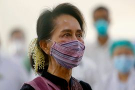 FILE - Then Myanmar leader Aung San Suu Kyi watches the vaccination of health workers at a hospital in Naypyitaw, Myanmar on Jan. 27, 2021. Myanmar’s imprisoned former leader, Aung San Suu Kyi, is suffering from symptoms of low blood pressure including dizziness and loss of appetite, but has been denied treatment at qualified facilities outside the prison system, a medical worker said Thursday Sept. 7, 2023. (AP Photo/Aung Shine Oo, File)