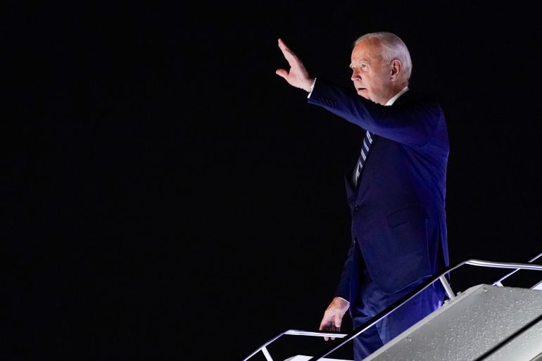 US President Joe Biden waves as he arrives in New Delhi, India, for the G20 summit