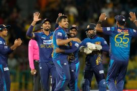 Sri Lankan team members celebrate the dismissal of Bangladeshes' Taskin Ahmed