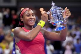 Coco Gauff holds up the US Open trophy