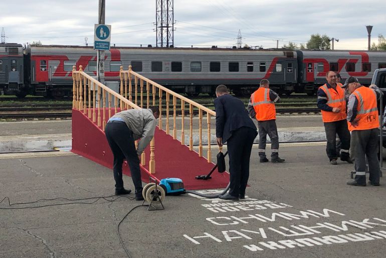 Workers prepare a temporary wooden ramp at the railway station for the arrival of the special train carrying North Korea's leader Kim Jong Un in Komsomolsk-on-Amur, about 6200 kilometers (3,900 miles) east of Moscow, in the Russian Far Eastern Amur region, Thursday, Sept. 14, 2023. (AP Photo)