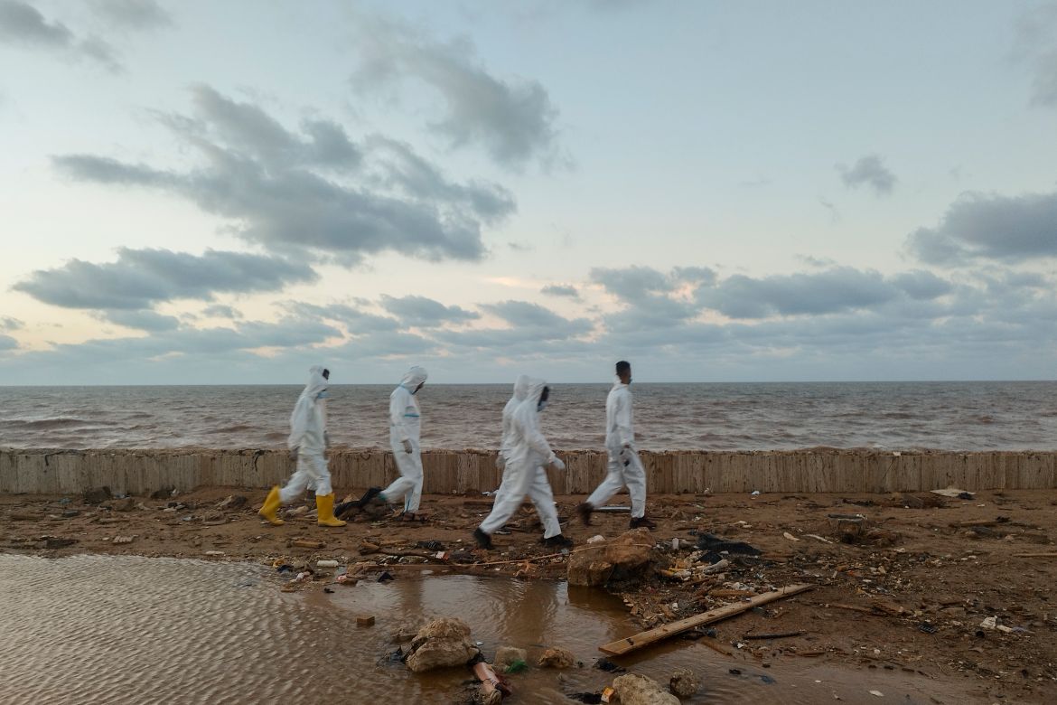 Rescuers search for bodies of the flood victims at the Corniche of the city of Derna