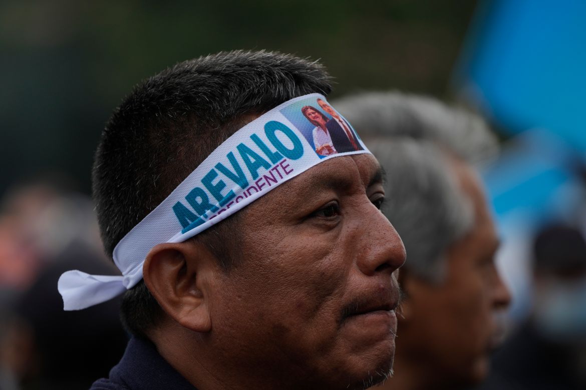 A demonstrator wears a head band with the image of Guatemala's President-elect Bernardo Arévalo, during a march by Indigenous people to demand the resignation of Guatemala's Attorney General Consuelo Porras, outside the Supreme Court building in Guatemala City,