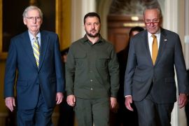 Ukrainian President Volodymyr Zelenskyy, center, walks with Democrat and Republican leaders of the Senate at Capitol Hill