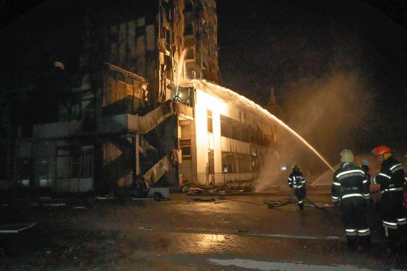 In this photo provided by the Odesa Region Administration, firefighters work to extinguish a fire in a hotel at the seaport after a Russian rocket attack in Odesa, Ukraine