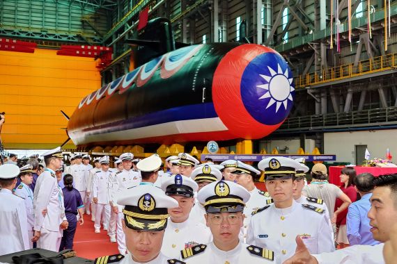 The new Taiwan submarine. Sailors in white uniforms are walking around it