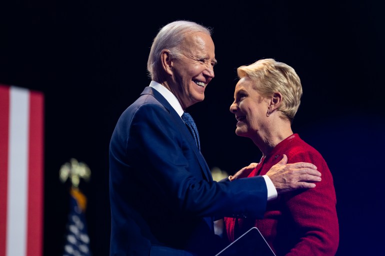 Joe Biden hugs Cindy McCain on stage in Tempe Arizona.