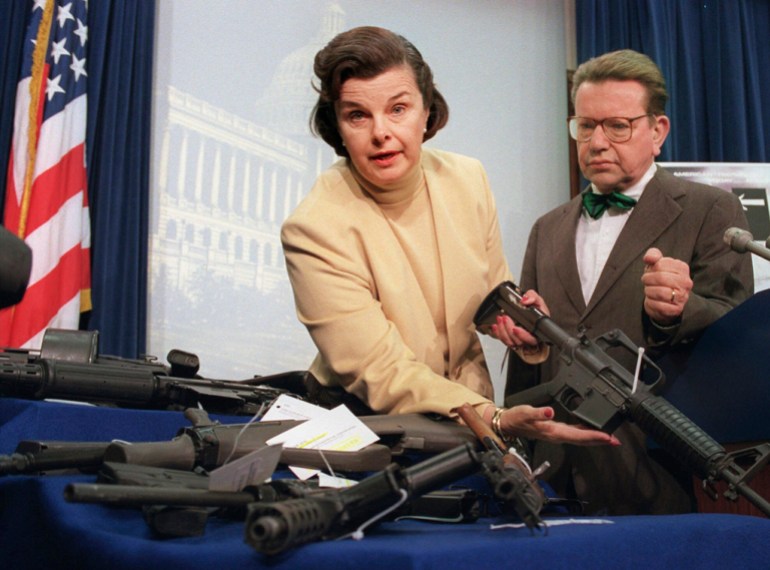 Dianne Feinstein holding an assault rifle