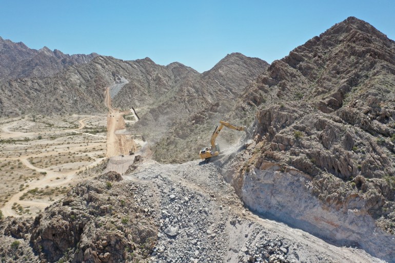 Border wall construction in a mountainous regio