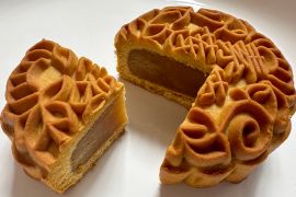 A traditional mooncake has golden crusty pastry filled with sweet lotus paste [Kate Mayberry/Al Jazeera]