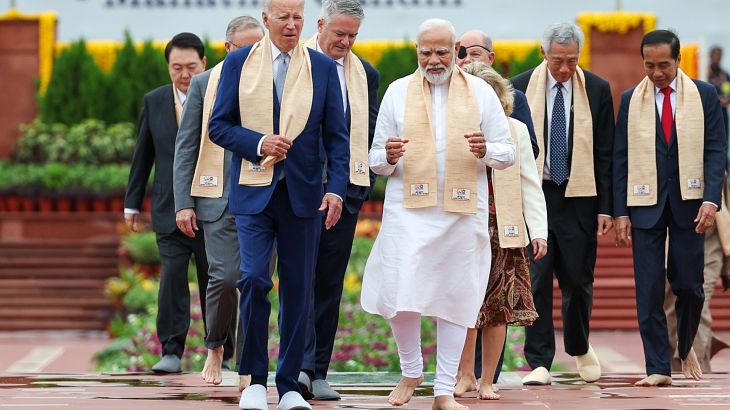 Prime Minister Narendra Modi walks with world leaders at Mahatma Gandhi's memorial in New Delhi