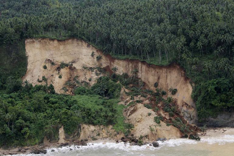 An aerial shot of a collapsed mountain side due to heavy rains in Davao Oriental province, in southern island of Mindanao on January 14, 2014