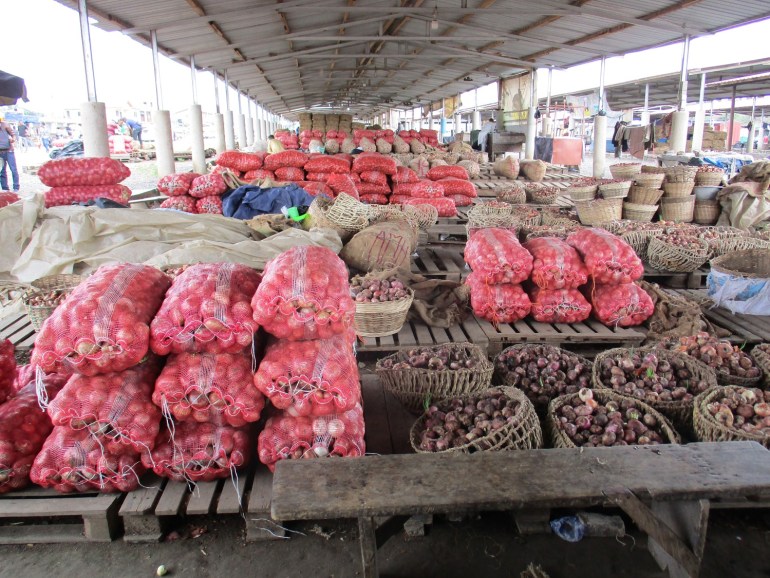 Sacks of onions under sheds at the Adjen Kotoku Market in Accra