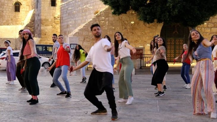 A group of dancers performing Afro-Dabke
