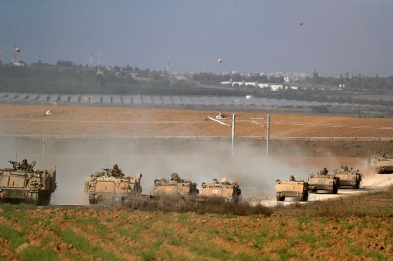 Israeli tanks take up position near Israel's border with the Gaza