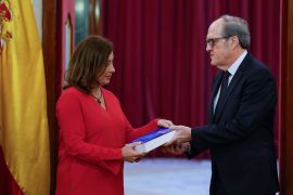 Spanish Ombudsman Angel Gabilondo (R) delivers to the Speaker of the Spanish Congress Francina Armengol (L) the Ombudsman's report on allegations of sexual abuse in the Spanish Catholic Church, in Madrid