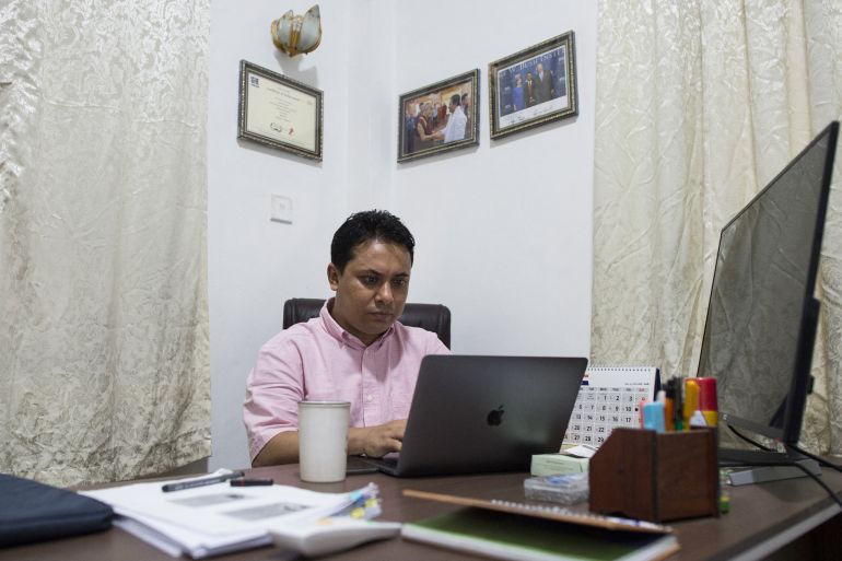 Aung Kyaw Moe pictured at work in 2018. He is in his office in Yangon.