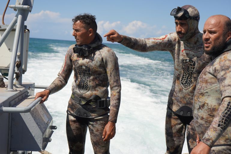 El-Hassi with his team of local divers tasked with finding missing bodies