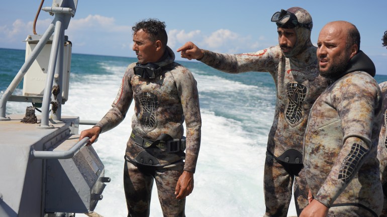 El-Hassi with his team of local divers tasked with finding missing bodies