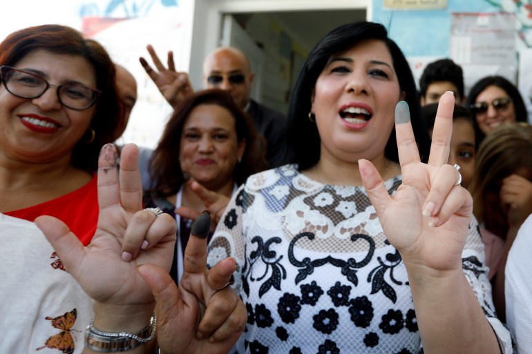 Presidential candidate Abir Moussi gestures after casting her vote at a polling station during presidential election in Tunis, Tunisia September 15, 2019.
