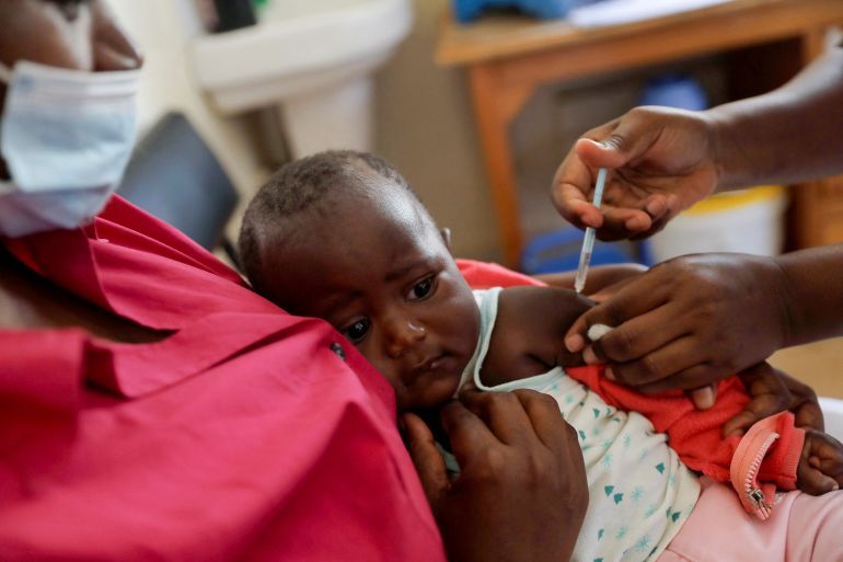 A nurse administers the malaria vaccine to an infant at the Lumumba Sub-County hospital in Kisumu, Kenya.