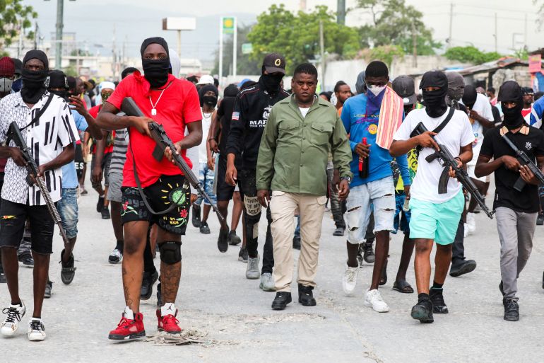 Former police officer Jimmy "Barbecue" Cherizier, leader of the 'G9' coalition, leads a march surrounded by his security against Haiti's Prime Minister Ariel Henry, in Port-au-Prince, Haiti September 19, 2023