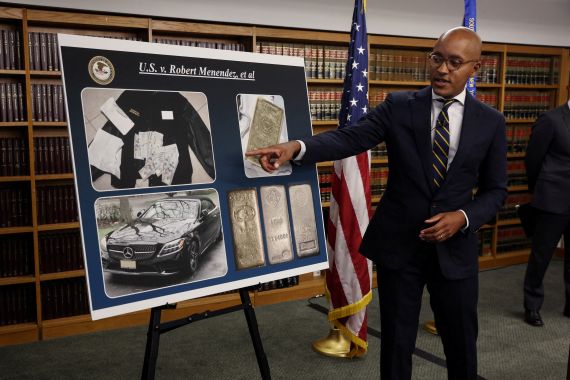 Justice Department official points to photos of items found in Menendez's house during search, including gold bars