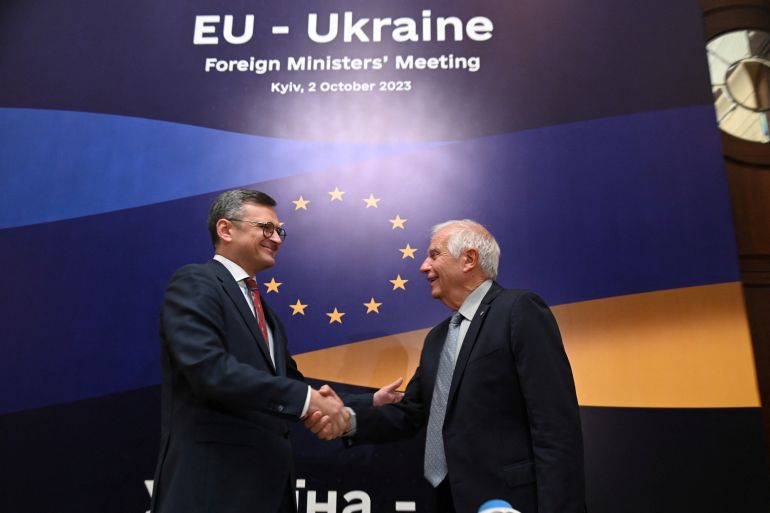 Ukrainian Foreign Minister Dmytro Kuleba and European Union Foreign Policy Chief Josep Borrell shake hands before EU-Ukraine foreign ministers meeting