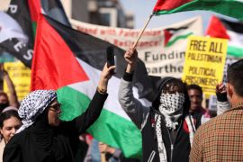 Protesters wave Palestinian flags