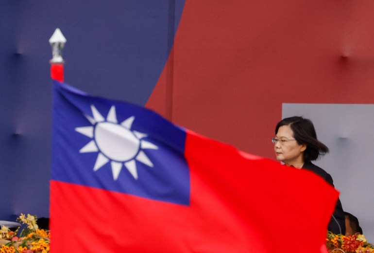 Taiwan's President Tsai Ing-wen speaking on National Day. There is a Taiwan flag in front of her.