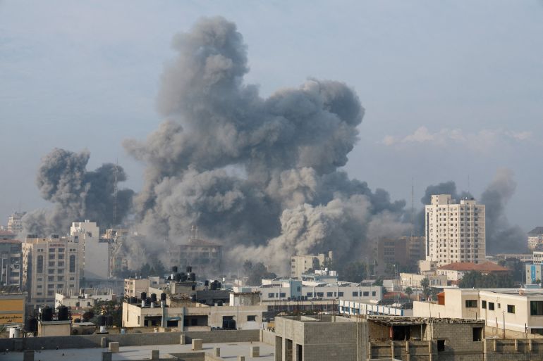 Smoke billows following Israeli strikes, in Gaza City, October 11, 2023