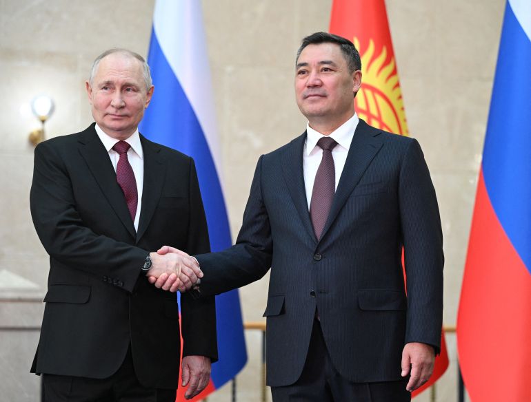 Russia's President Vladimir Putin shakes hands with Kyrgyzstan's President Sadyr Japarov