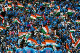A sea of blue shirts and Indian flags filled the Narendra Modi Stadium in Ahmedabad on Saturday [Amit Dave/Reuters]