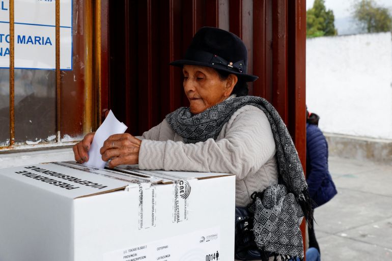 A person votes at a polling station during the presidential election, in Toacaso, Ecuador