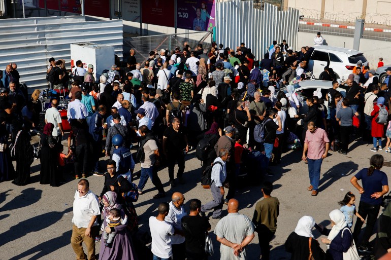 Seen from above, crowds mill around outside the Rafah Crossing on the border of Gaza and Egypt, as Israeli bombardment in Gaza continues.