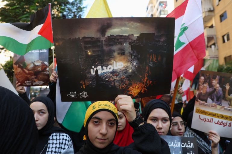 Hezbollah supporters take part in a protest, after hundreds of Palestinians were killed in a blast at Al-Ahli hospital in Gaza that Israeli and Palestinian officials blamed on each other, in Beirut's southern suburbs, Lebanon October 18, 2023. REUTERS/Mohamed Azakir NO RESALES. NO ARCHIVES