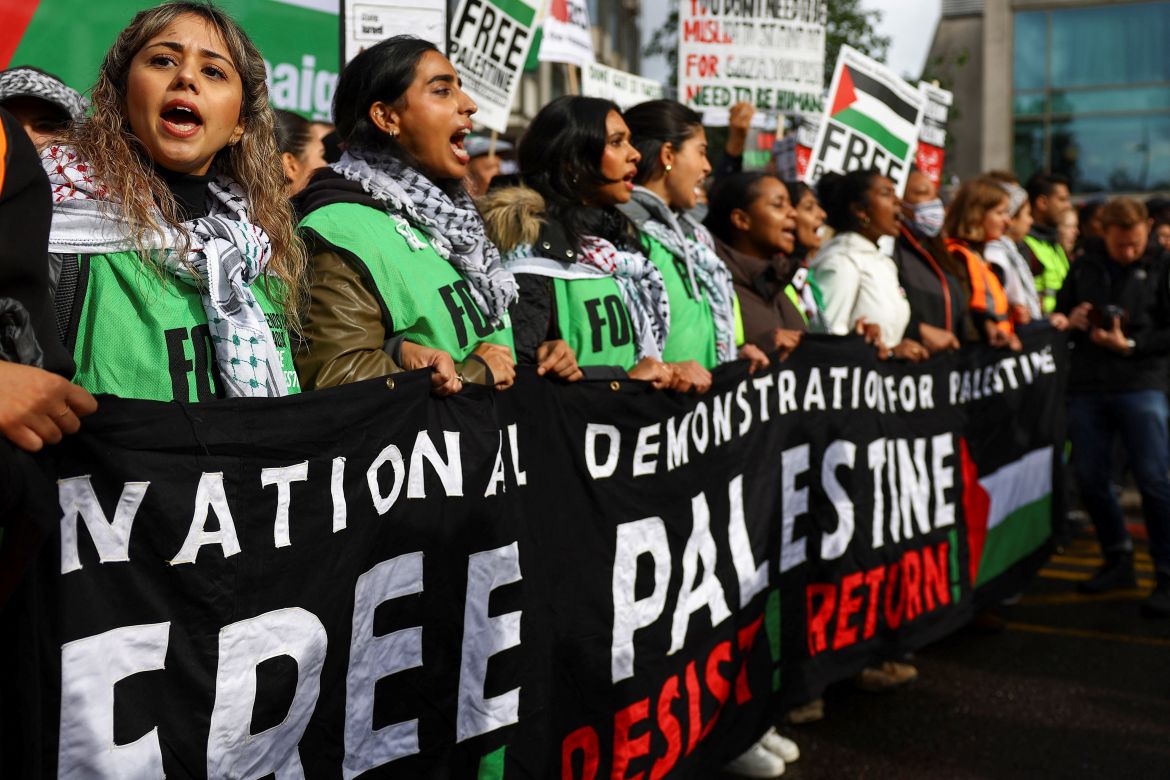 Demonstrators hold a banner, at a protest in solidarity with Palestinians in Gaza, in London