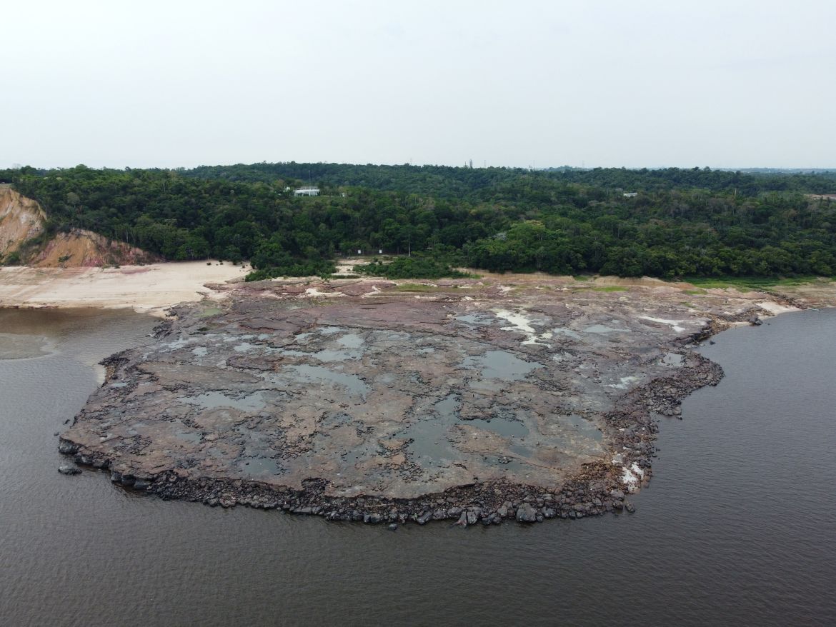 A view of ancient stone carvings on a rocky point of the Amazon river