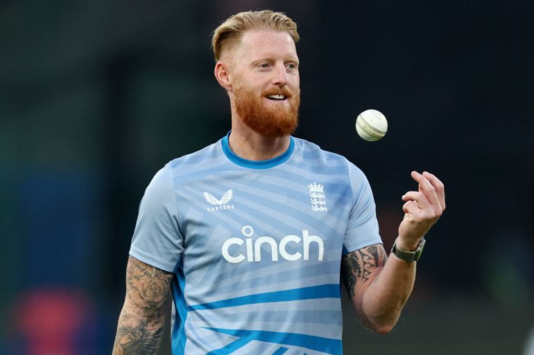 England's Ben Stokes thorws a ball up into the air during practice