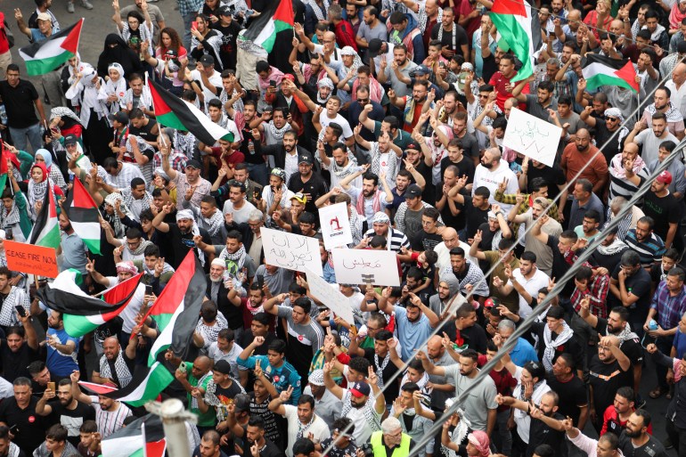 Jordanians gather during a protest in support of Palestinians in Gaza, amid the ongoing conflict between Israel and Hamas