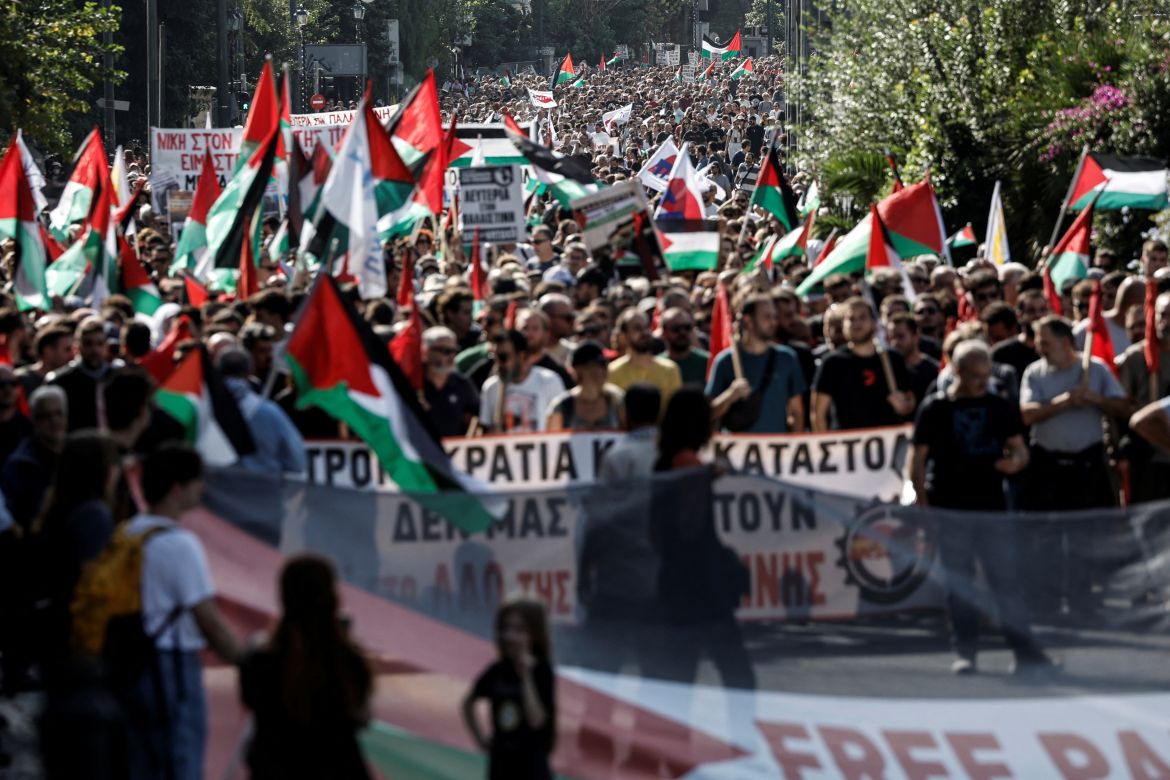 People march towards the Israeli embassy shouting 'stop bombing' during a pro-Palestinian protest in Athens, Greece