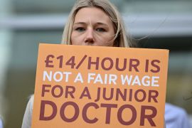 Doctors say the raises in their salaries have not been keeping up with high inflation amid a cost of living crisis in the UK. [File: Justin Tallis/AFP]