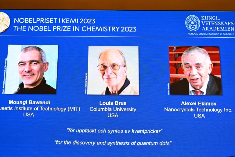 A screen shows this year's laureates US Chemist Moungi Bawendi, US Chemist Louis Brus and Russian physicist Alexei Ekimov during the announcement of the winners of the 2023 Nobel Prize in chemistry at Royal Swedish Academy of Sciences in Stockholm on October 4, 2023