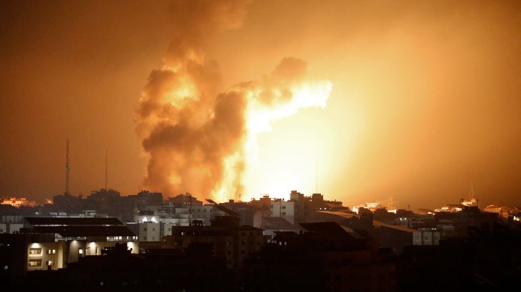 Fire and smoke rises above buildings during an Israeli air strike in Gaza City on October 8, 2023