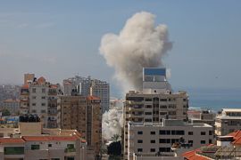 Smoke billows from a residential building following an Israeli air strike in Gaza City. [Mohammed Abed/AFP]