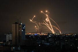 An Israeli missile launched from the Iron Dome defence missile system attempts to intercept a rocket, fired from the Gaza Strip, over the city of Netivot in southern Israel on October 8, 2023 [Mahmud Hams/AFP]