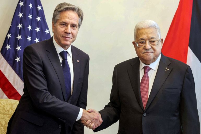 Blinken and Abbas shake hands