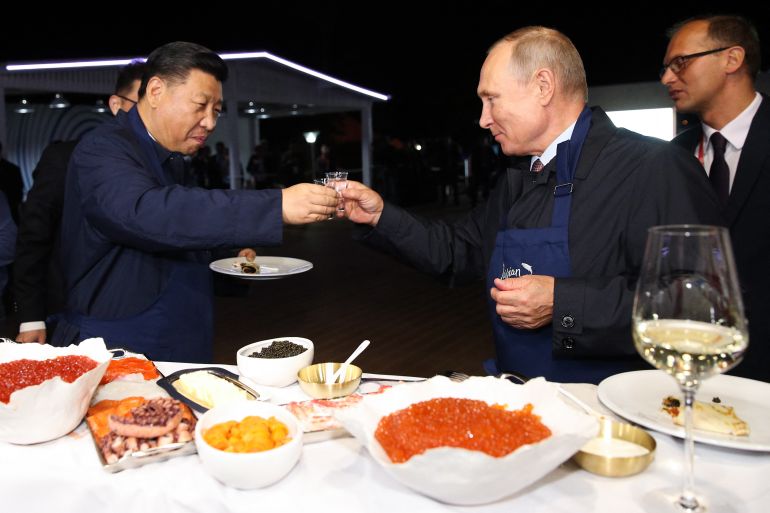 Putin and Xi share a toast in Vladivostok in September 2018