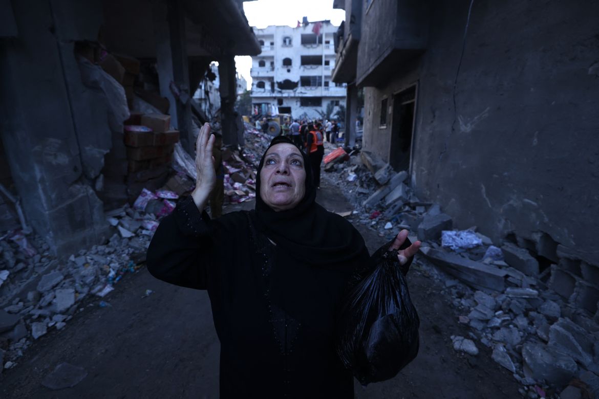 A Palestinian reacts amidst the rubble of a building after an Israeli airstrike on the Rafah refugee camp